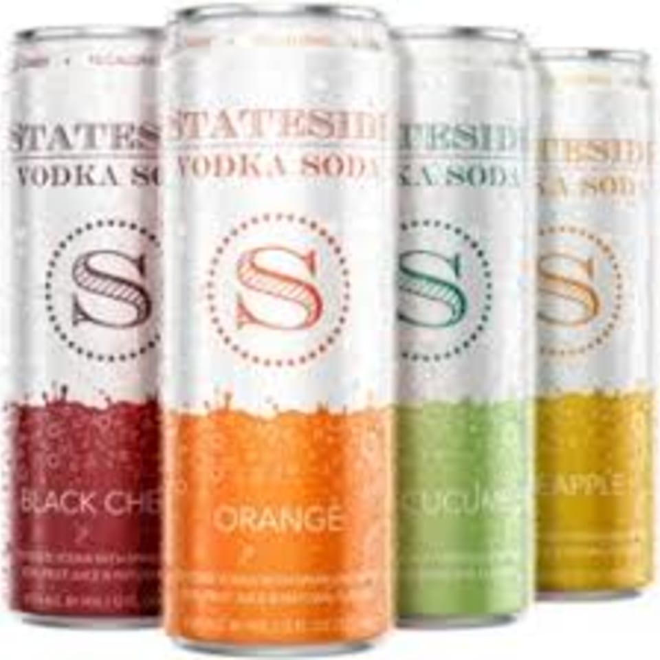 Four Stateside Vodka Soda cans in black cherry, orange, cucumber, and pineapple flavors.