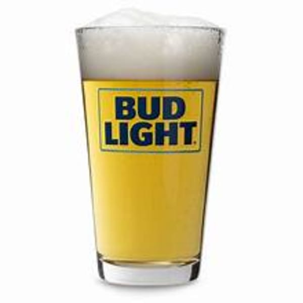 A glass of Bud Light beer with a foamy head, isolated on a white background.