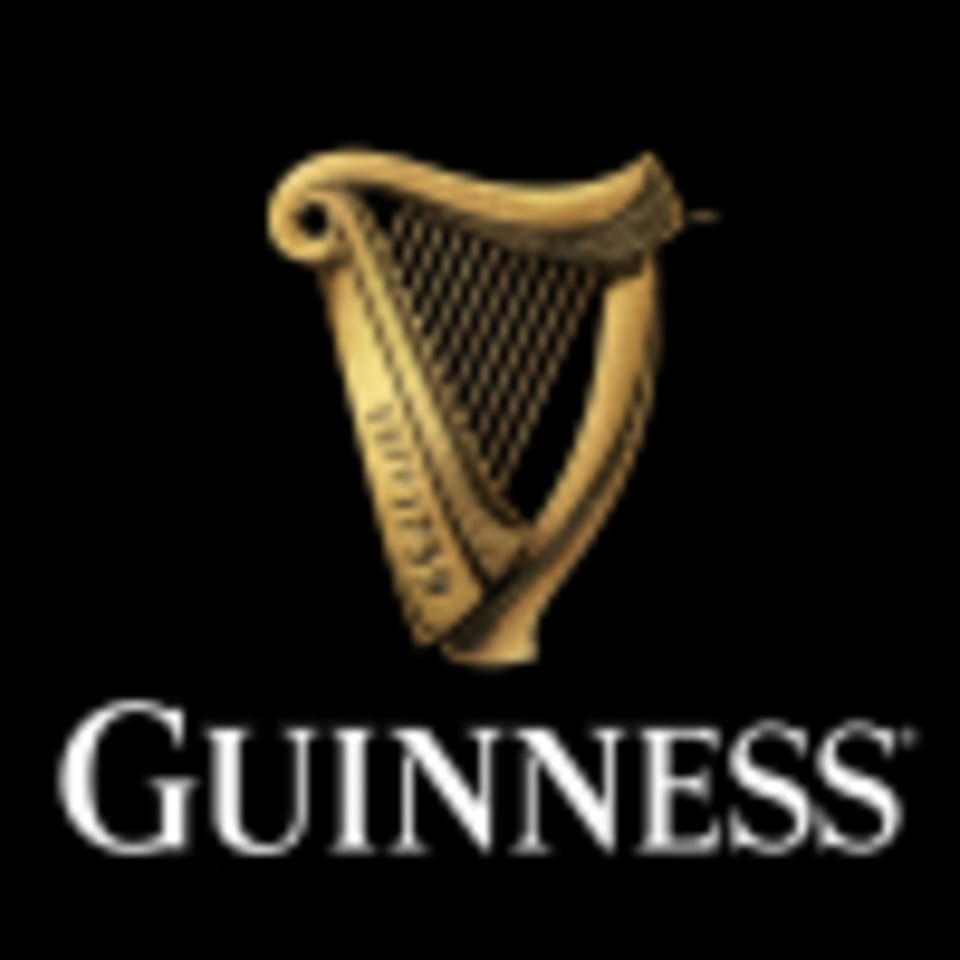 Guinness logo featuring a golden harp above the white "Guinness" text on a black background.