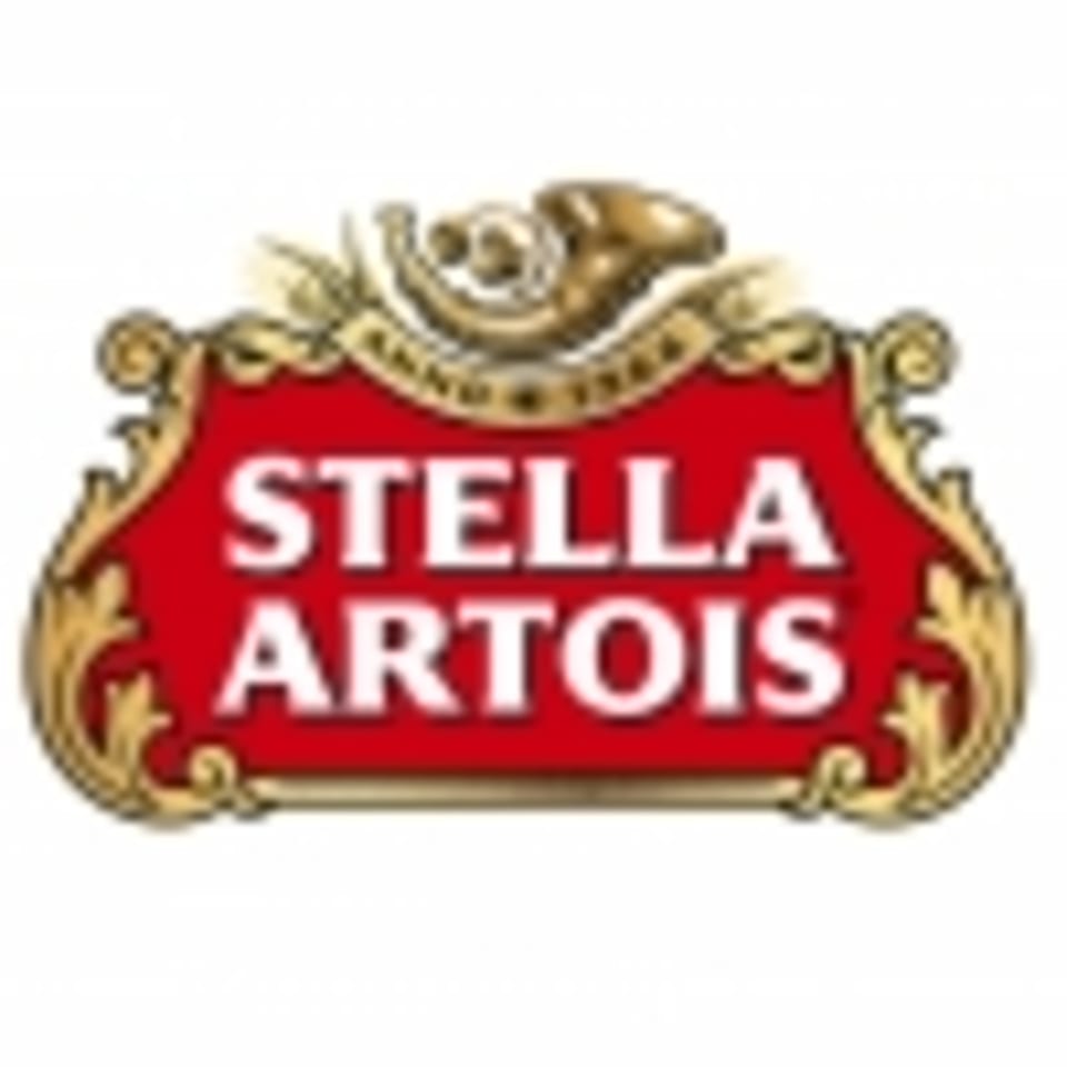 Stella Artois logo with a red shield, gold trim, and a horn at the top.